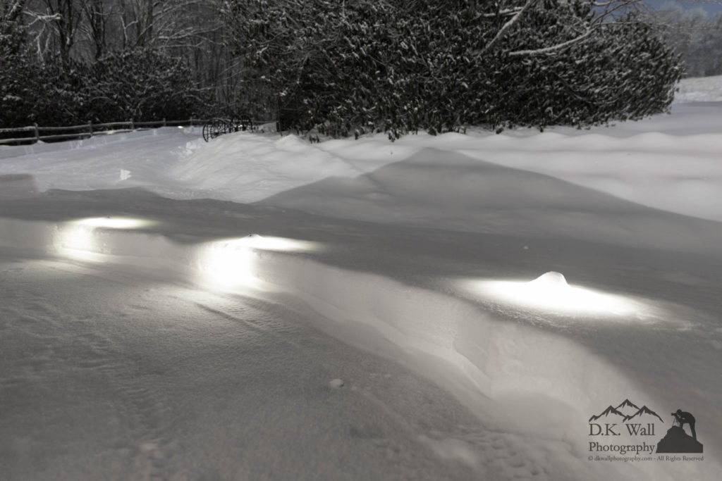 Glowing snow caused by landscape lighting